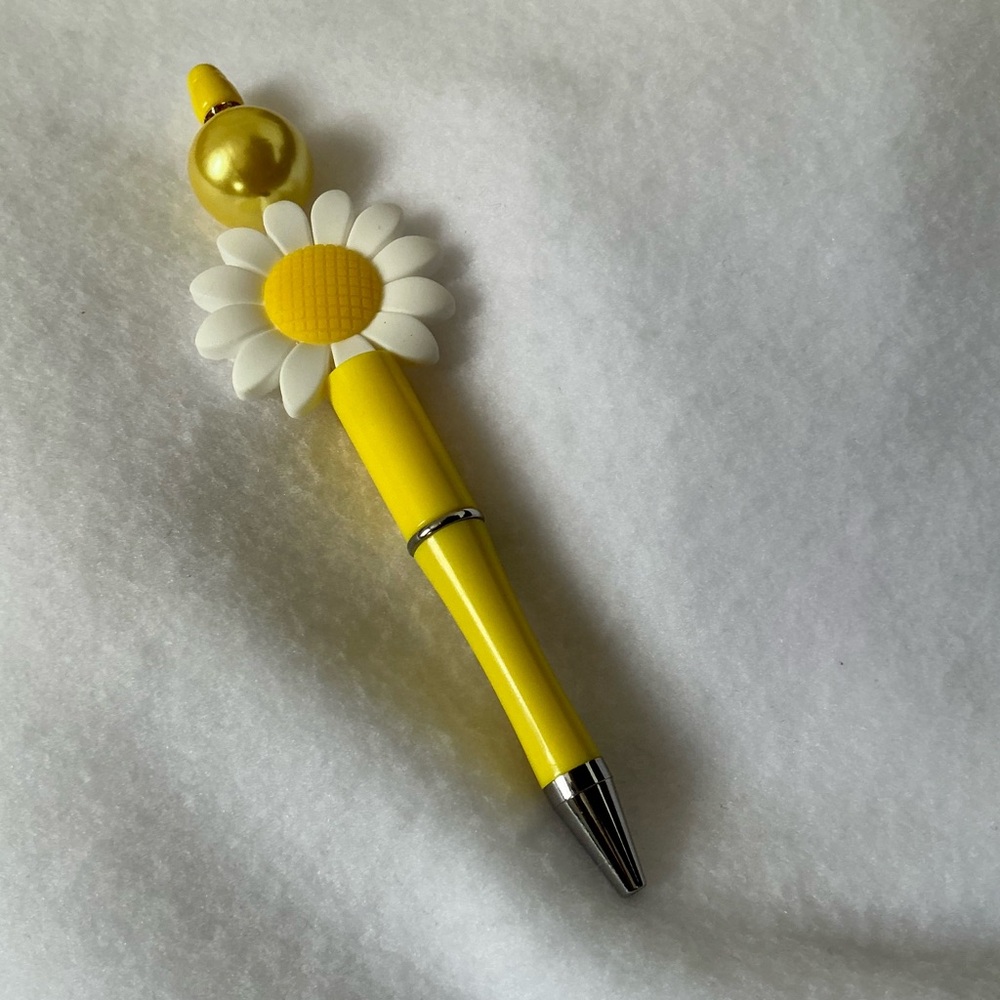 Homemade beaded pen, black ink .